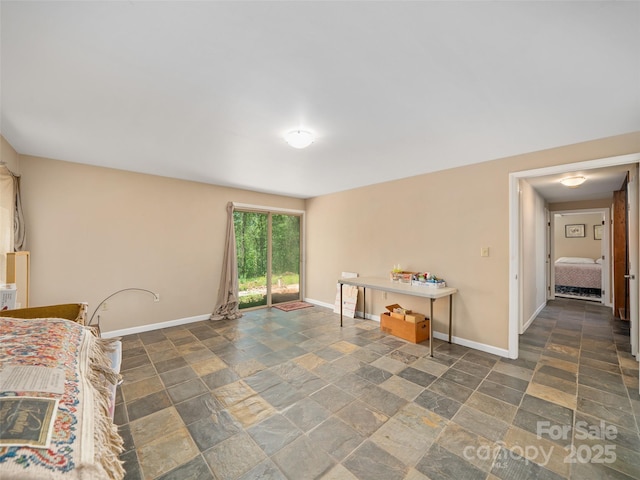 19 Old Patton Hill Rd, Swannanoa, NC 28778 - bedroom with stone tile flooring and baseboards