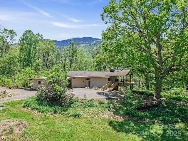 19 Old Patton Hill Rd, Swannanoa, NC 28778 - rear view of house with asphalt driveway, a forest view, stairs, and a mountain view