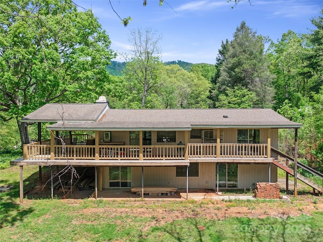 19 Old Patton Hill Rd, Swannanoa, NC 28778 - rear view of property featuring stairs, a shingled roof, a deck, and a forest view