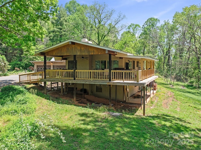 19 Old Patton Hill Rd, Swannanoa, NC 28778 - rear view of house with ceiling fan, a wooden deck, a chimney, a yard, and driveway