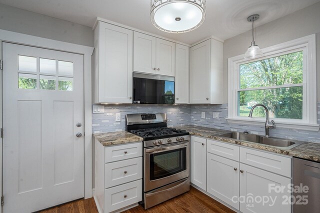 692 S Pink St, Cherryville, NC 28021 - kitchen with tasteful backsplash, appliances with stainless steel finishes, light stone counters, and a sink