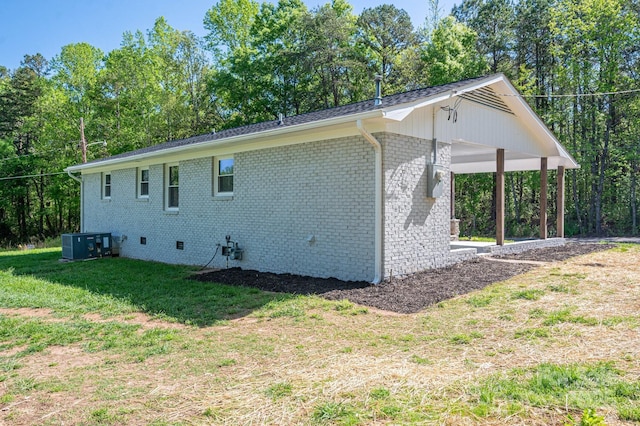 692 S Pink St, Cherryville, NC 28021 - view of home's exterior with central AC unit, crawl space, an attached carport, a lawn, and brick siding