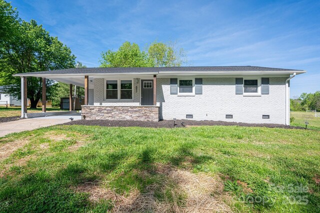 692 S Pink St, Cherryville, NC 28021 - view of front of property with an attached carport, driveway, brick siding, crawl space, and a front yard