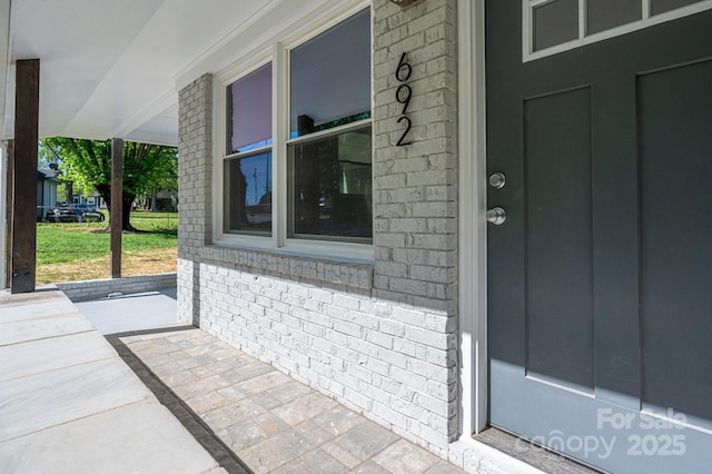 692 S Pink St, Cherryville, NC 28021 - entrance to property featuring covered porch and brick siding