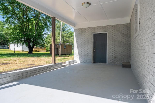 692 S Pink St, Cherryville, NC 28021 - view of patio with an outdoor structure and a storage shed