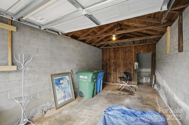 interior space with concrete block wall
