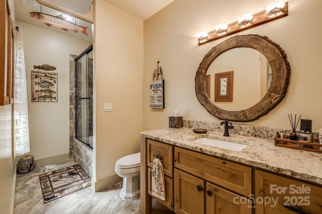 full bath with vanity and toilet