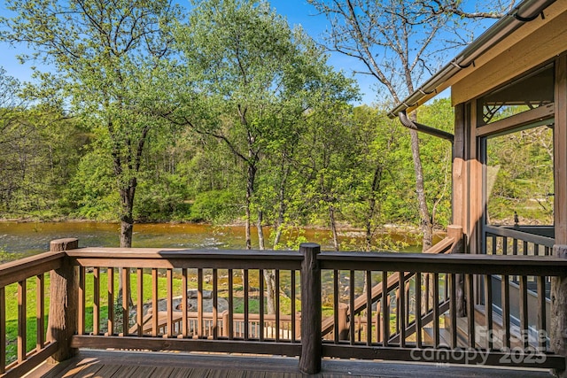 wooden deck with a water view