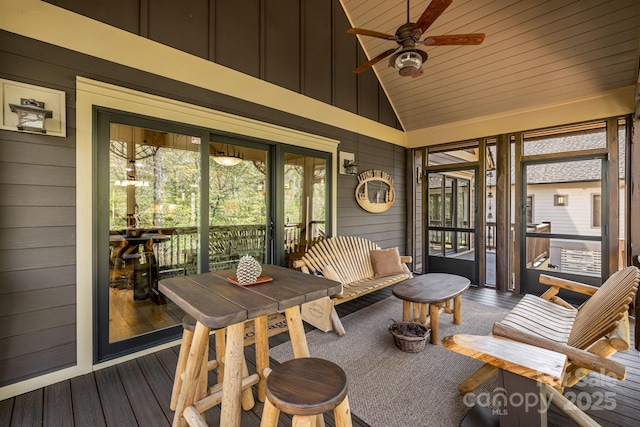 sunroom featuring ceiling fan