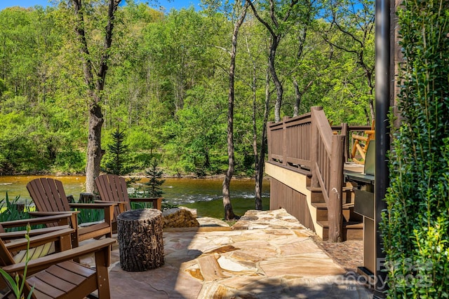 view of patio with a wooded view