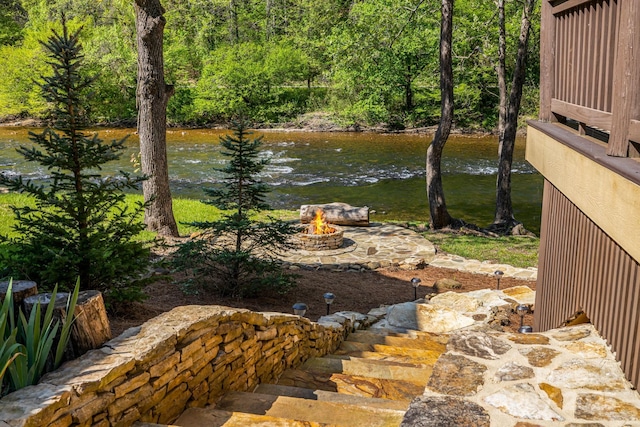 view of yard with a fire pit