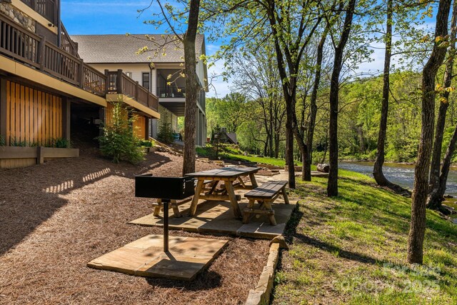 view of yard featuring a patio area and a deck