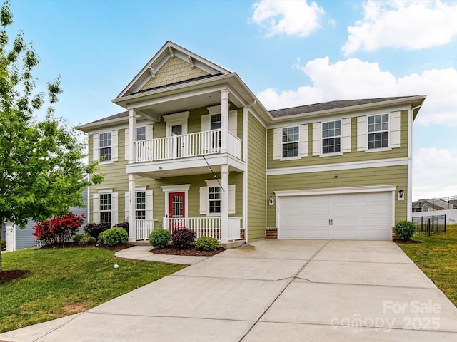 15747 Reynolds Dr, Indian Land, SC 29707 - view of front facade with a balcony, concrete driveway, a front lawn, an attached garage, and a porch