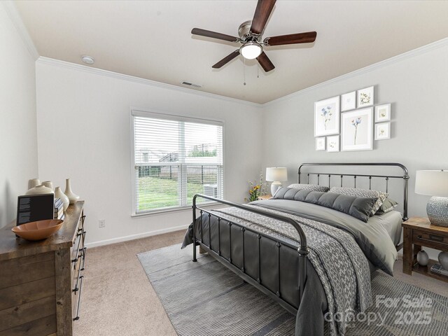 15747 Reynolds Dr, Indian Land, SC 29707 - carpeted bedroom featuring baseboards, a ceiling fan, visible vents, and crown molding
