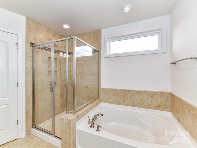 15747 Reynolds Dr, Indian Land, SC 29707 - bathroom featuring recessed lighting, a bath, and a shower stall