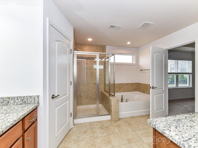 15747 Reynolds Dr, Indian Land, SC 29707 - full bathroom with plenty of natural light, a garden tub, vanity, and a stall shower