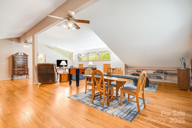 dining room with a ceiling fan, lofted ceiling with beams, and wood finished floors
