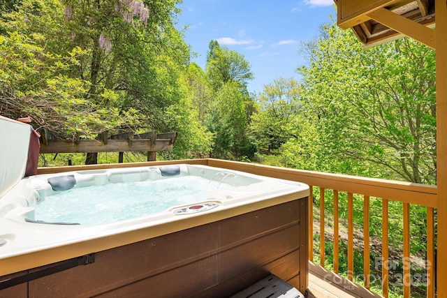 deck with a hot tub