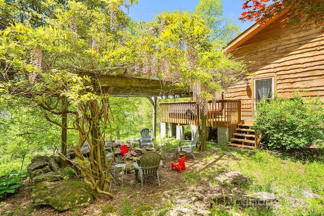 view of yard featuring stairs and a deck