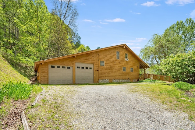 view of side of home featuring a garage
