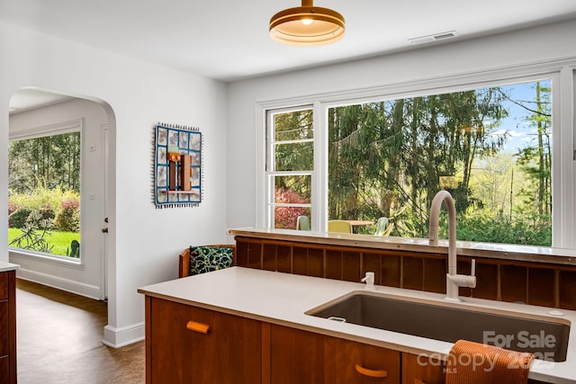 80 Sunset Dr, Marshall, NC 28753 - kitchen with a sink, a healthy amount of sunlight, light countertops, and visible vents