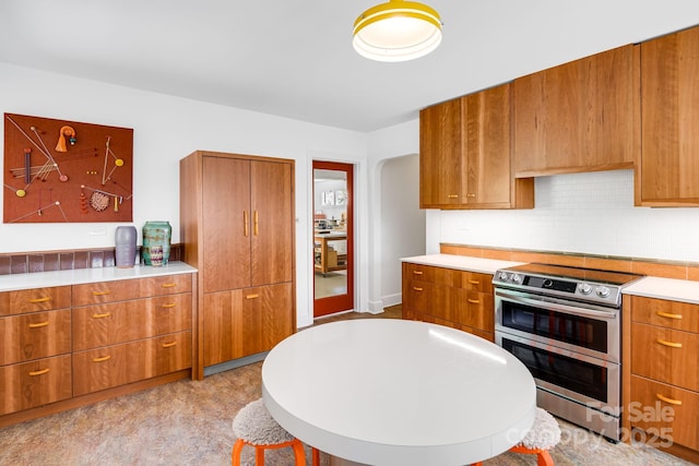 80 Sunset Dr, Marshall, NC 28753 - kitchen featuring brown cabinetry, modern cabinets, double oven range, and light countertops