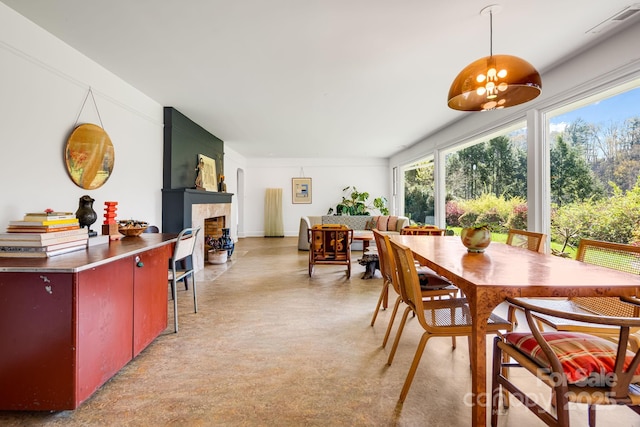 80 Sunset Dr, Marshall, NC 28753 - dining space featuring a tile fireplace, visible vents, and plenty of natural light
