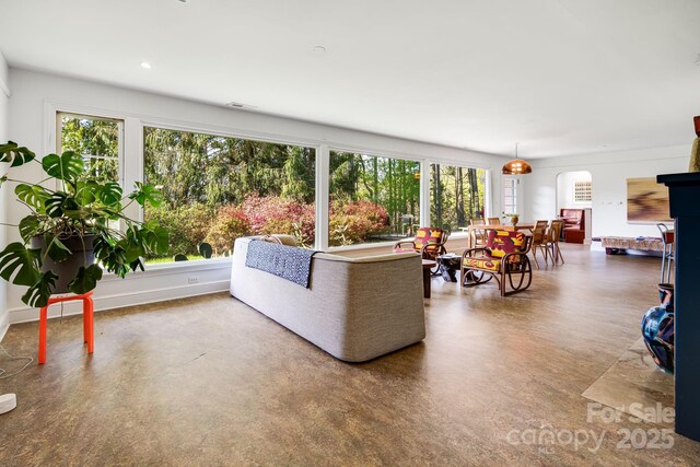 80 Sunset Dr, Marshall, NC 28753 - living area with finished concrete floors, visible vents, and arched walkways