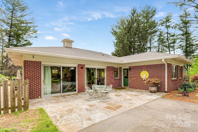 80 Sunset Dr, Marshall, NC 28753 - rear view of property with brick siding, roof with shingles, fence, and a patio area