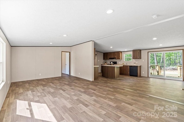unfurnished living room with light wood-style floors and recessed lighting