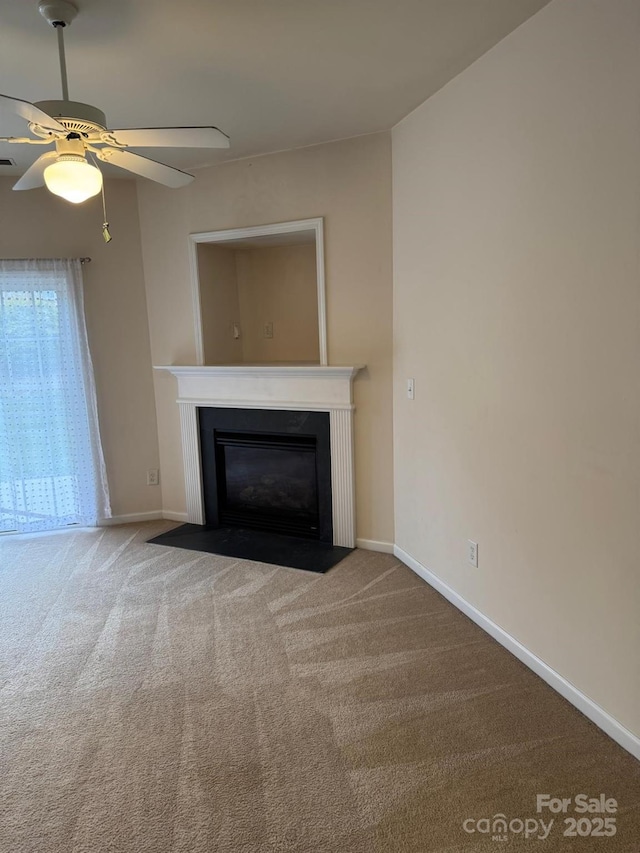 9668 Walkers Glen Dr NW, Concord, NC 28027 - unfurnished living room featuring a fireplace with flush hearth, carpet, baseboards, and ceiling fan