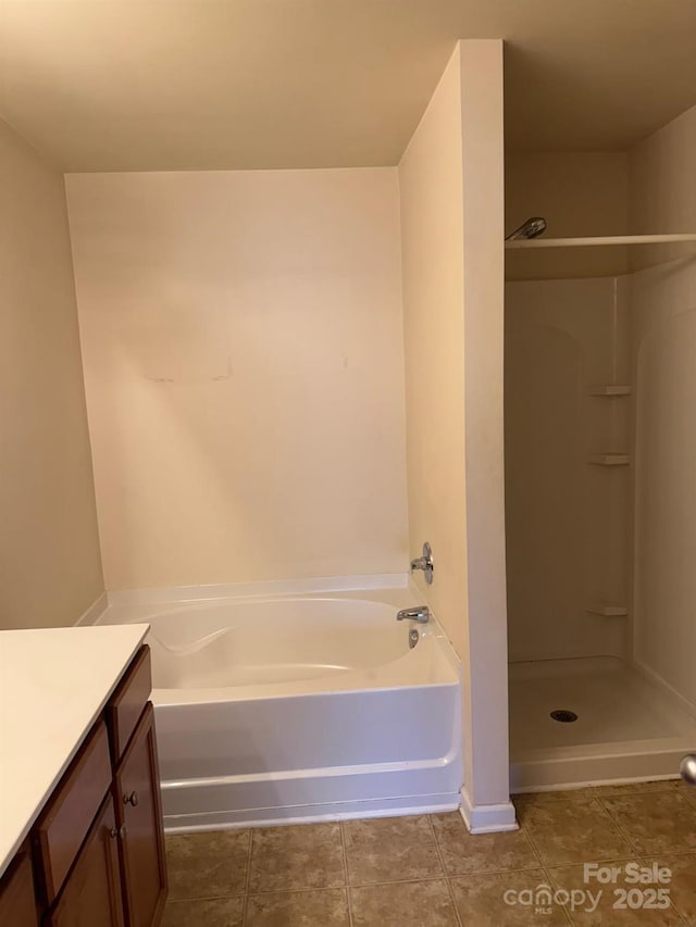 9668 Walkers Glen Dr NW, Concord, NC 28027 - bathroom with vanity, a shower, a bathtub, and tile patterned flooring