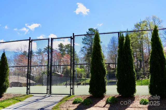 view of gate featuring fence