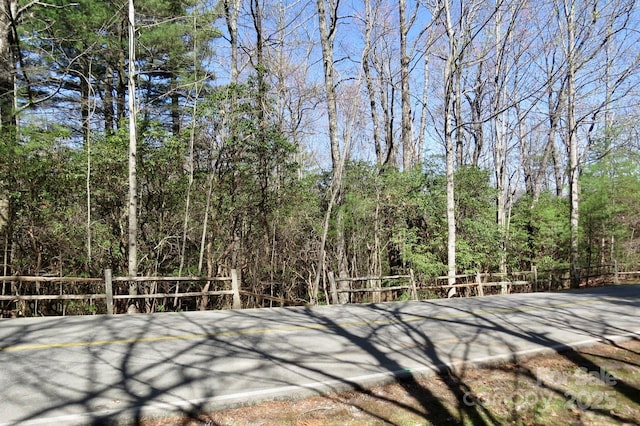 exterior space featuring a forest view