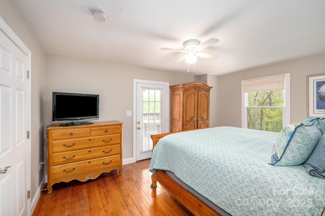 bedroom featuring a ceiling fan, baseboards, access to exterior, and light wood-style flooring
