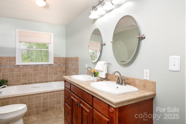 full bathroom featuring double vanity, toilet, a sink, and a garden tub