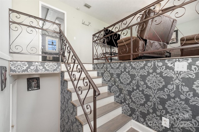 staircase with visible vents