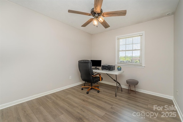 home office with ceiling fan, baseboards, and wood finished floors