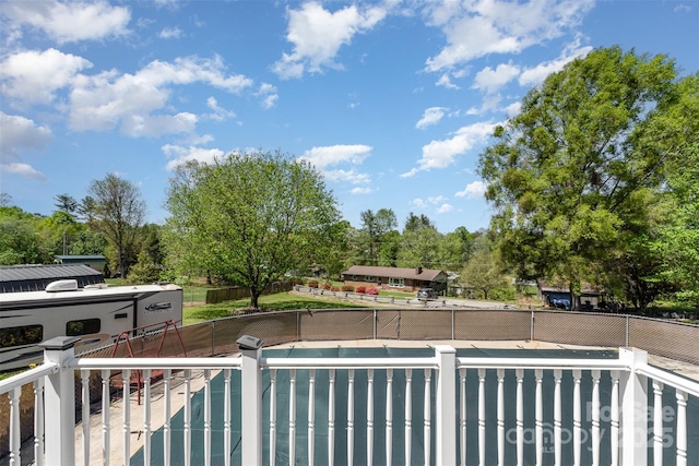 exterior space with a fenced in pool, a patio area, and fence