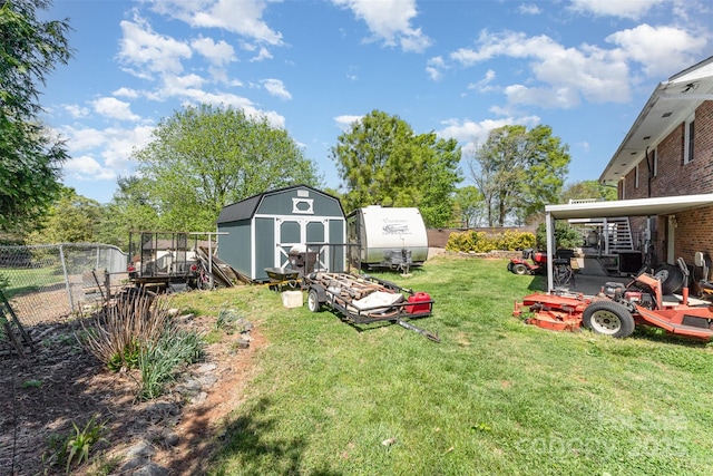view of yard with a storage shed, fence, and an outdoor structure