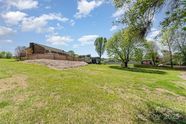 view of yard with fence