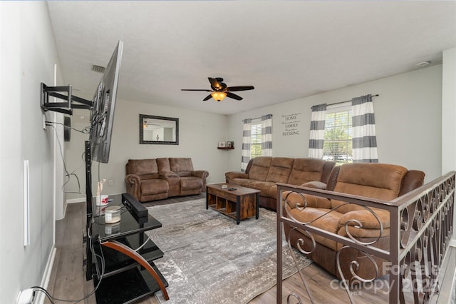 220 Hilltop St, Connelly Springs, NC 28612 - living room with wood finished floors, ceiling fan, and baseboards