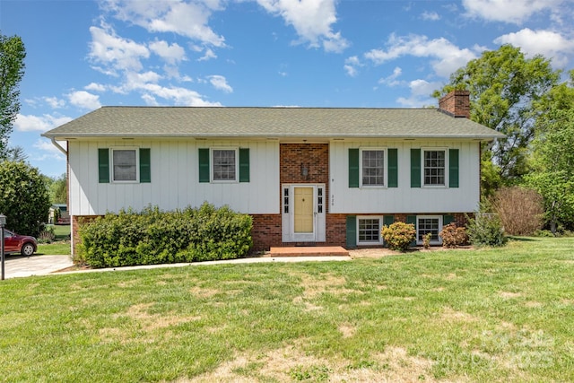 220 Hilltop St, Connelly Springs, NC 28612 - bi-level home with a chimney, a front yard, brick siding, and roof with shingles