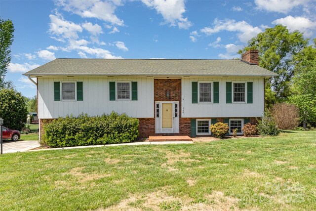 220 Hilltop St, Connelly Springs, NC 28612 - raised ranch with a chimney, brick siding, a front yard, and roof with shingles