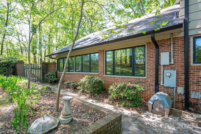 1058 General Hoke Dr, Lincolnton, NC 28092 - exterior space featuring a gate, brick siding, and fence