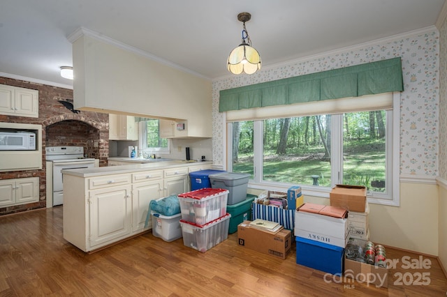1058 General Hoke Dr, Lincolnton, NC 28092 - kitchen featuring ornamental molding, light countertops, white appliances, and light wood-type flooring