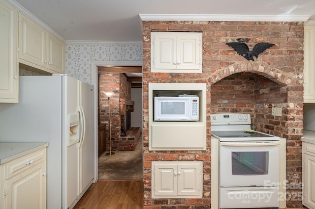 1058 General Hoke Dr, Lincolnton, NC 28092 - kitchen featuring white appliances, light wood-type flooring, light countertops, cream cabinetry, and ornamental molding