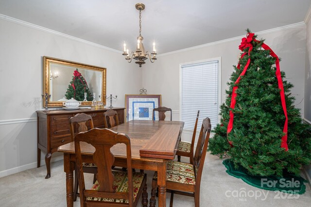 1058 General Hoke Dr, Lincolnton, NC 28092 - dining area with baseboards, light colored carpet, ornamental molding, and an inviting chandelier