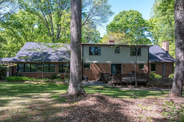 1058 General Hoke Dr, Lincolnton, NC 28092 - back of property with a chimney, a wooden deck, brick siding, and a yard