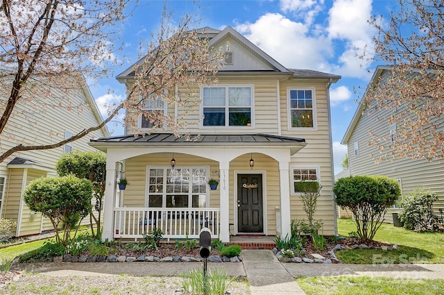 13610 Aldenbrook Dr, Huntersville, NC 28078 - view of front of home with a porch, a standing seam roof, and metal roof
